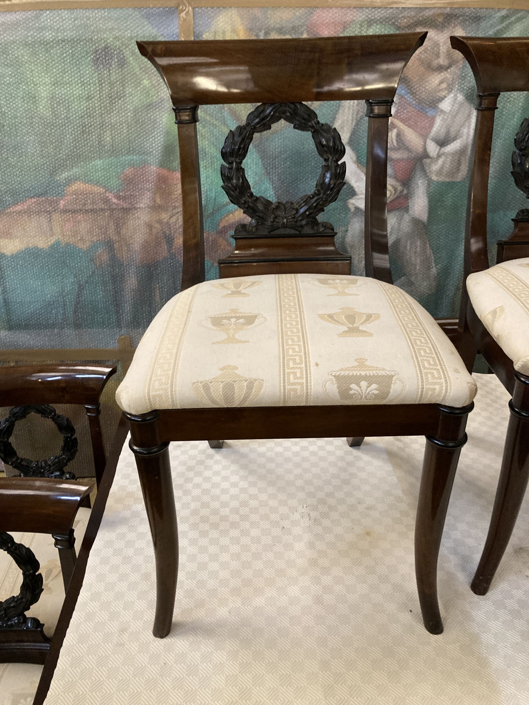 A Regency style mahogany dining suite, comprising rectangular dining table, 176cm extended (one spare leaf), six chairs and a side cabi